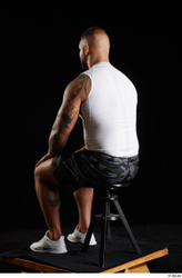 Whole Body Man White Sports Shorts Muscular Sitting Top Studio photo references